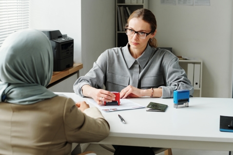 Woman talking with another woman